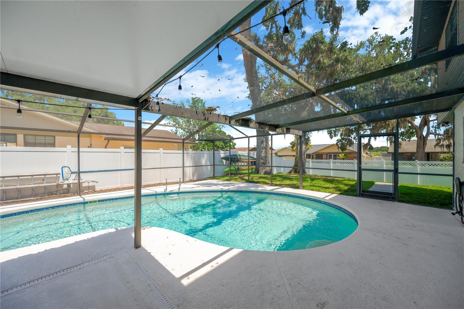 There is plenty of patio space around the pool for lounging furniture.