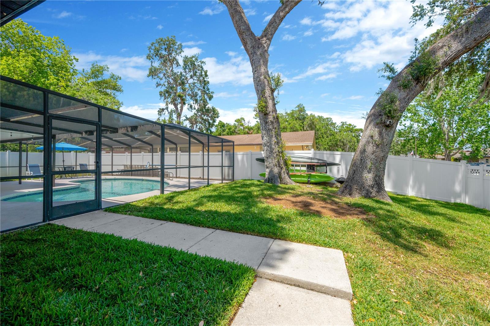 This spacious corner lot offers an expansive side yard, fully enclosed with vinyl fencing that extends all the way to the front yard for added privacy and security.