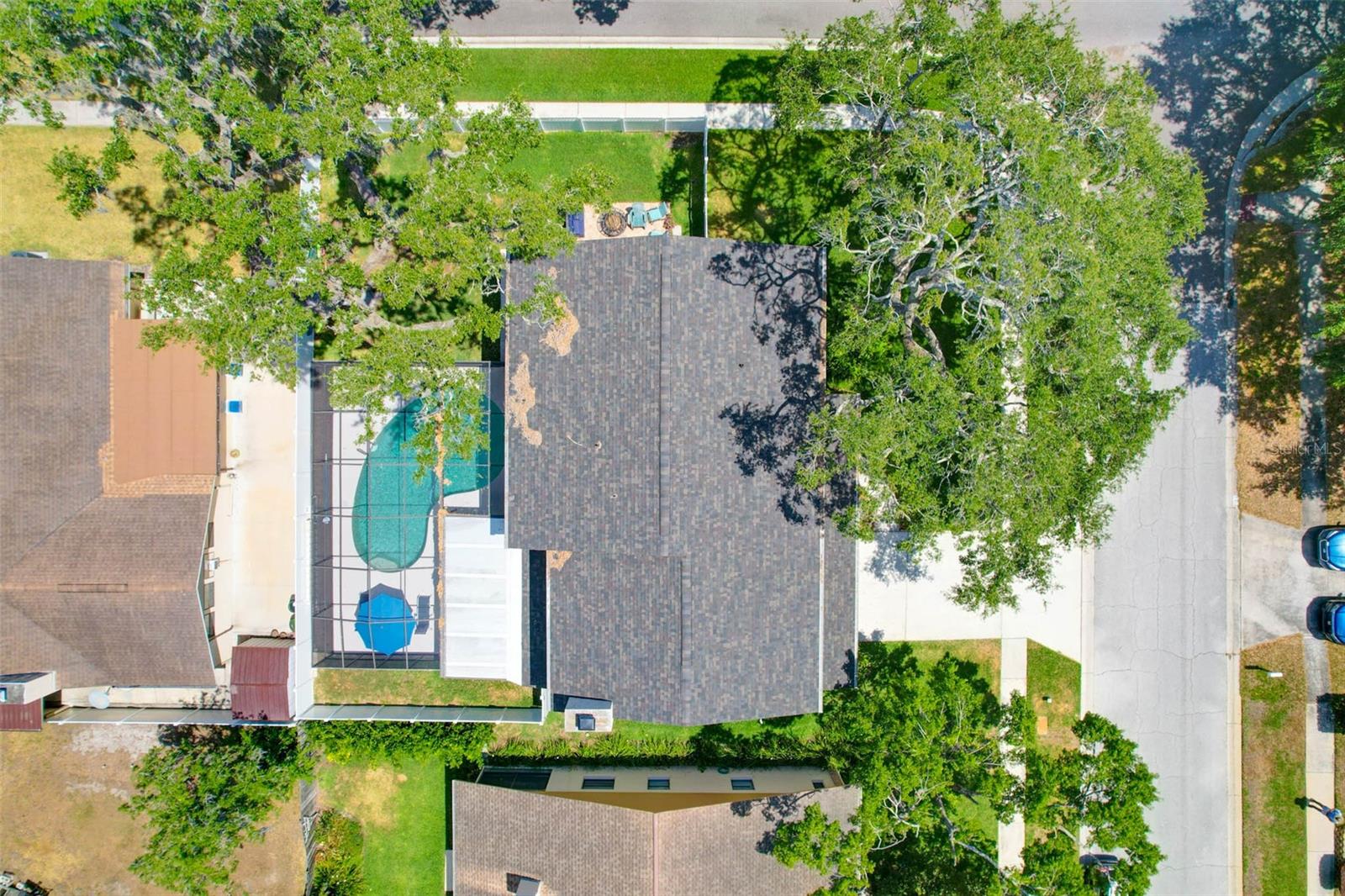 Aerial view of corner lot.  Chimney cap replacement & chimney cleaning (2025)Re-shingled roof & Leaf Filter gutter guards added (2023)