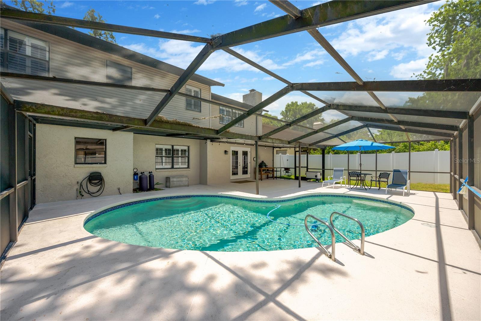 Enjoy Florida living at its finest in the oversized screened and covered lanai or take a dip in the inviting pool.