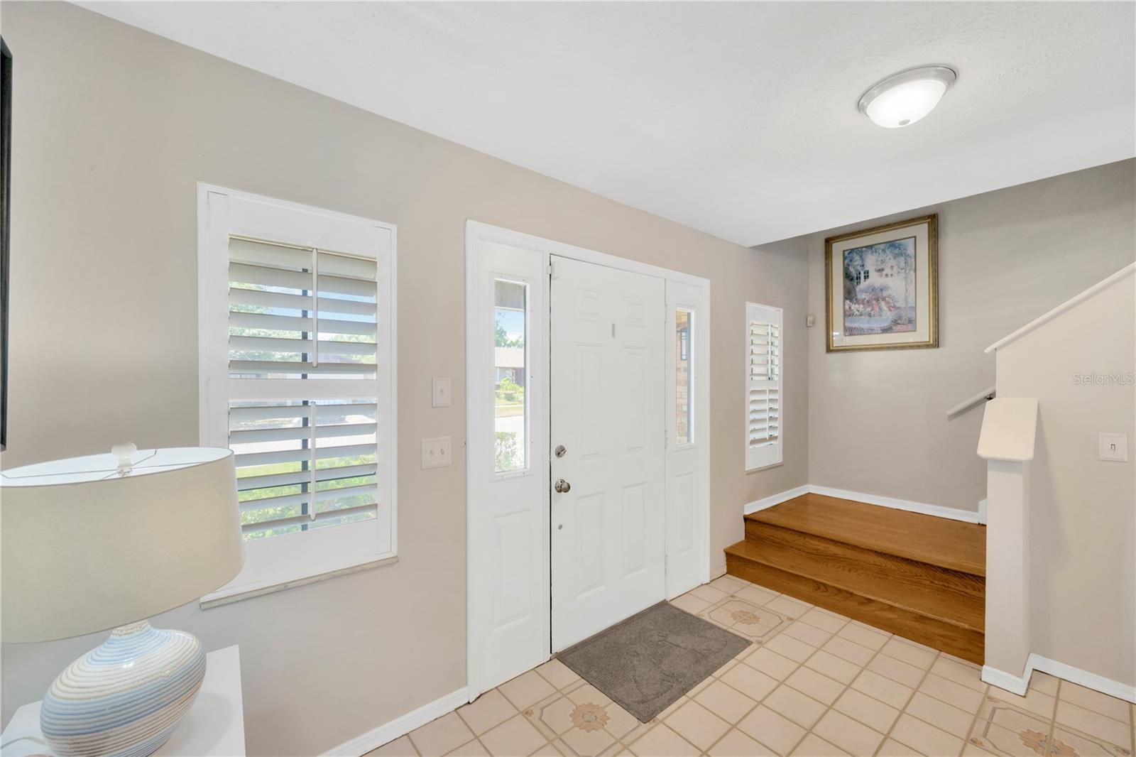 Front door with side lites and foyer.