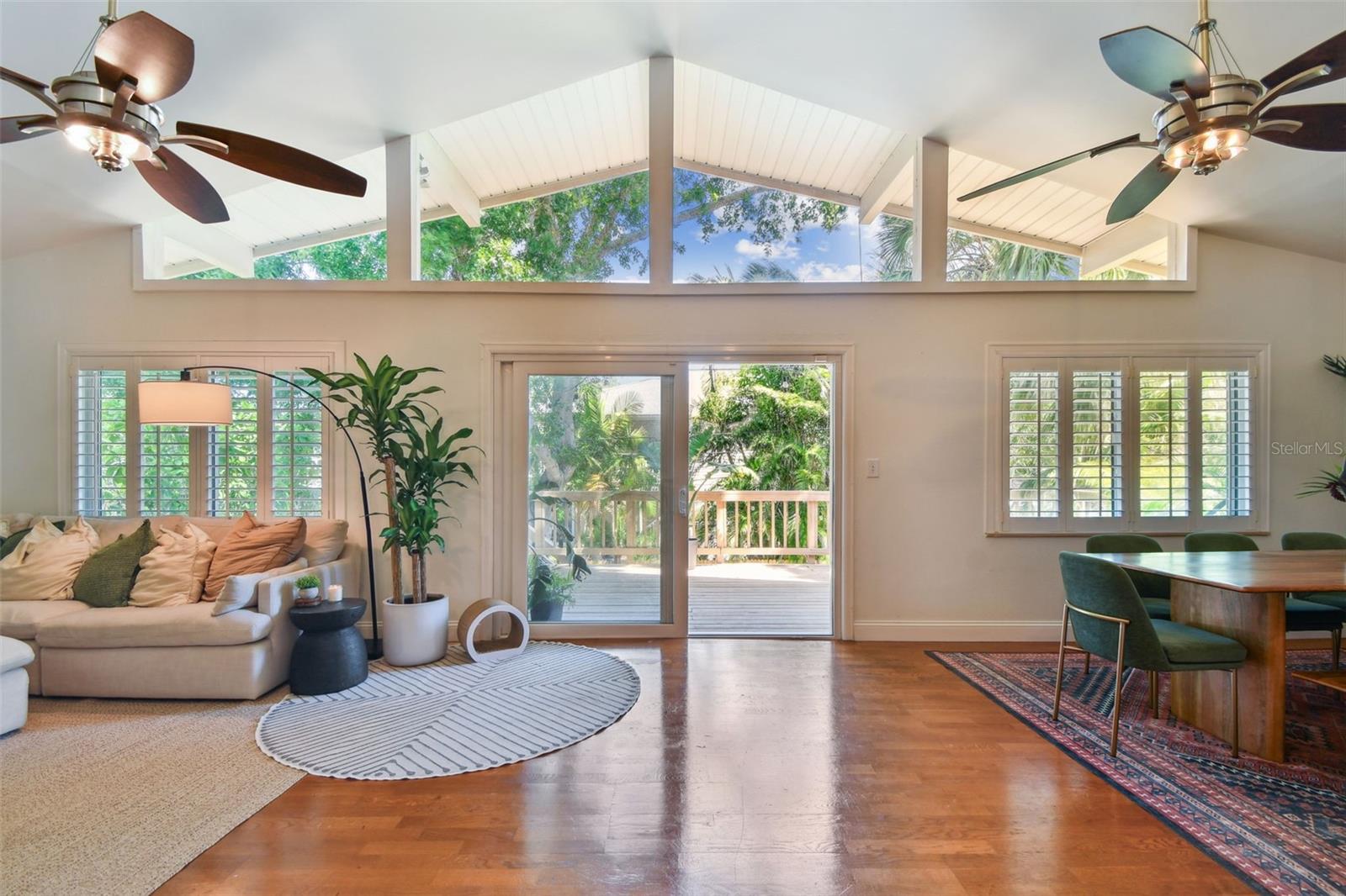 Living space with cathedral ceilings and tons of windows