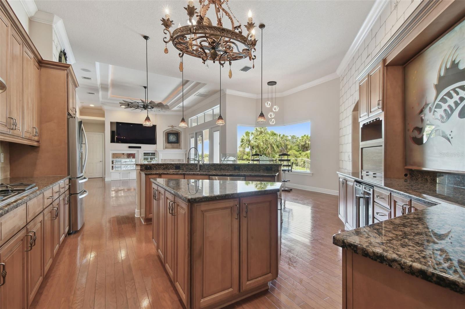 View of the kitchen looking toward family room and breakfast area.
