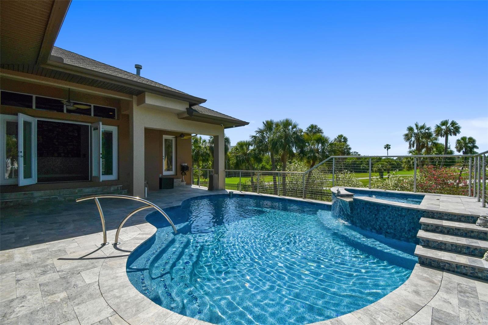 Pool and spa with custom railing.