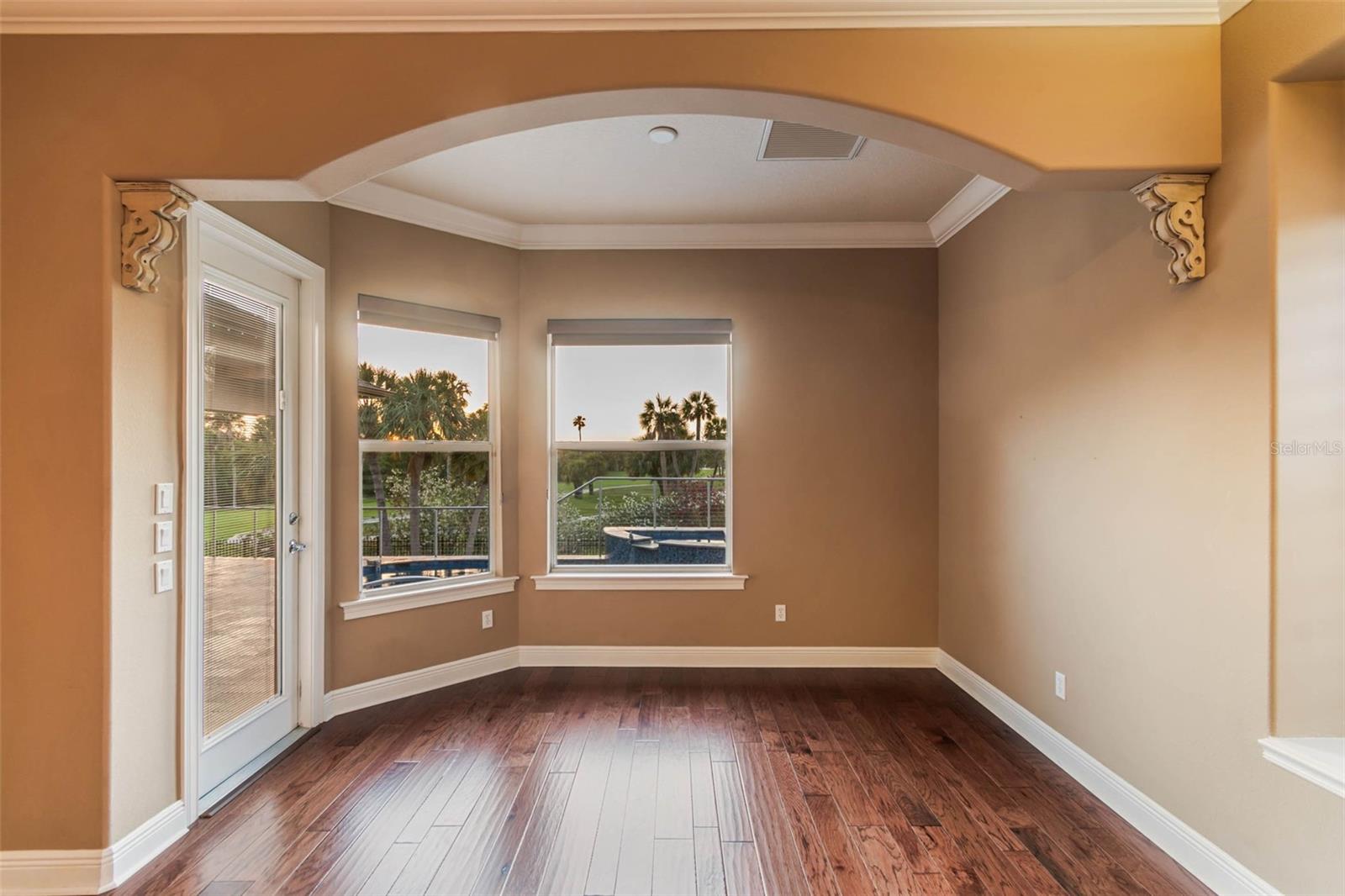 Sitting area in primary bedroom with views of the pool area, golf course and sunsets.