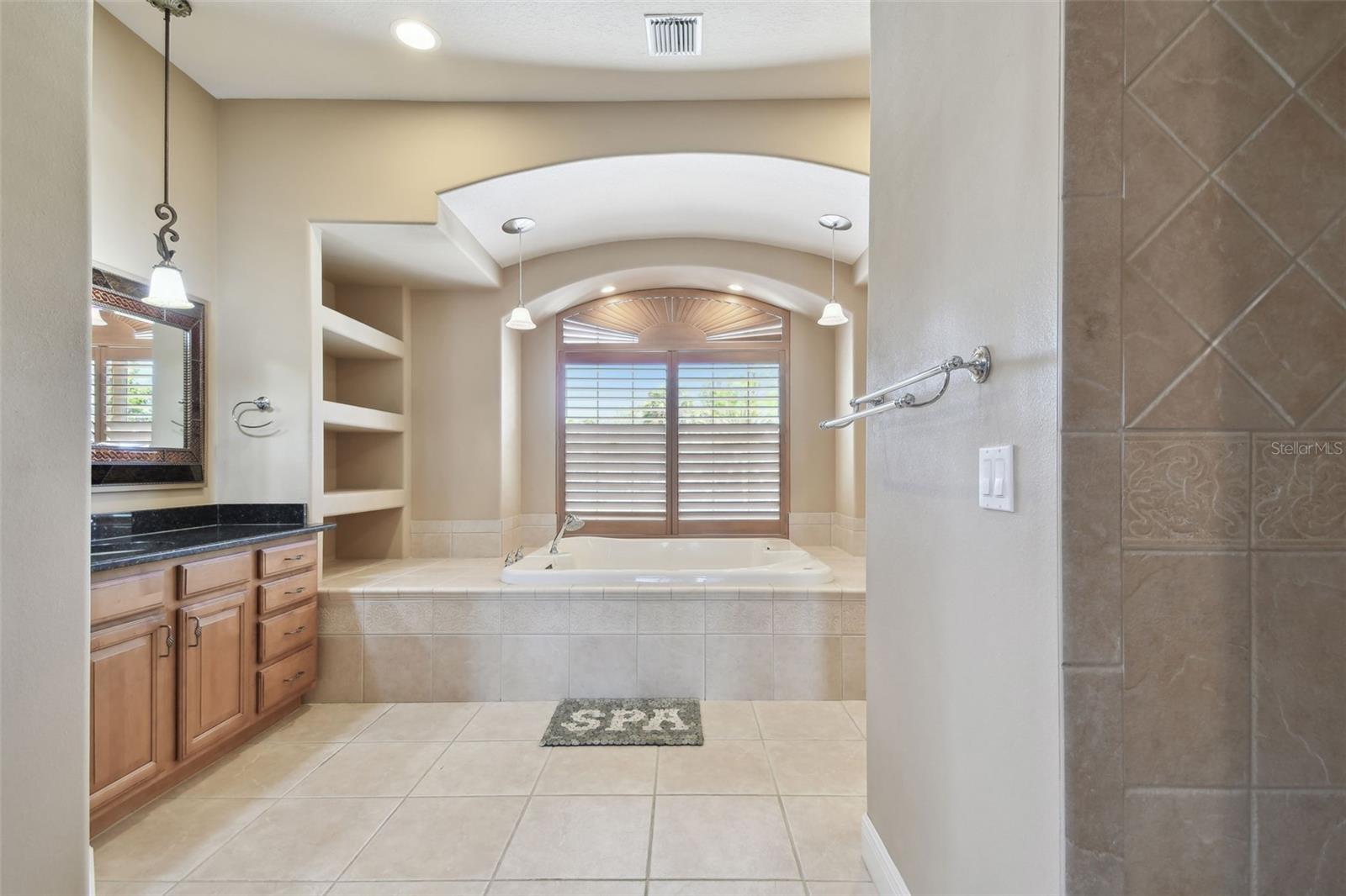 Primary bathroom with two person whirlpool tub.