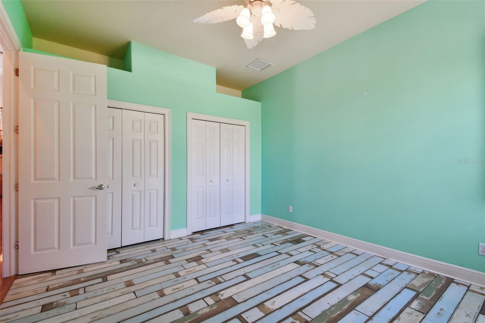 Bedroom One with vinyl flooring