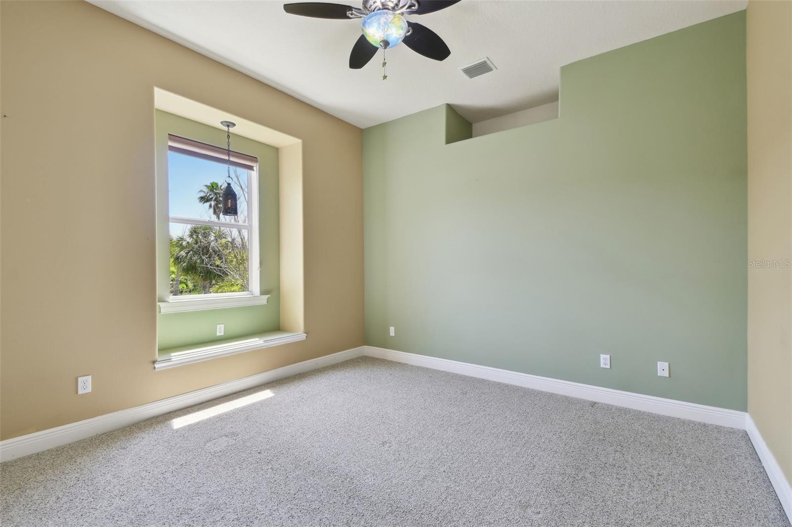 Bedroom Two with a window seat.