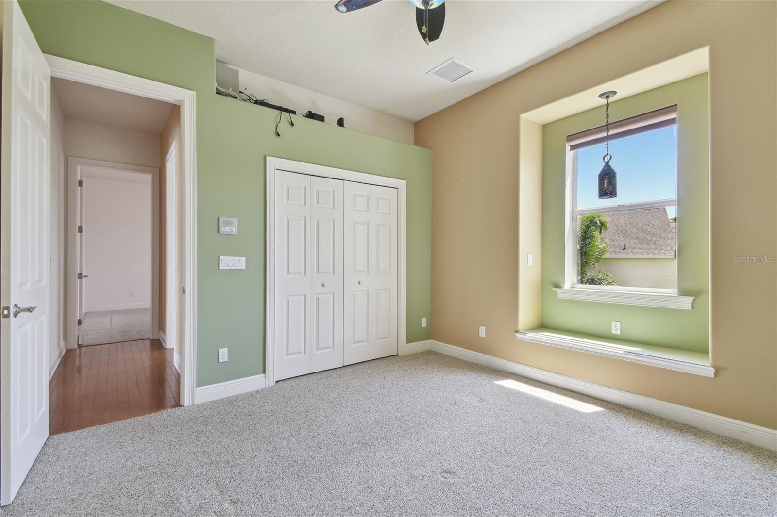 Bedroom Two with a view of the golf course.