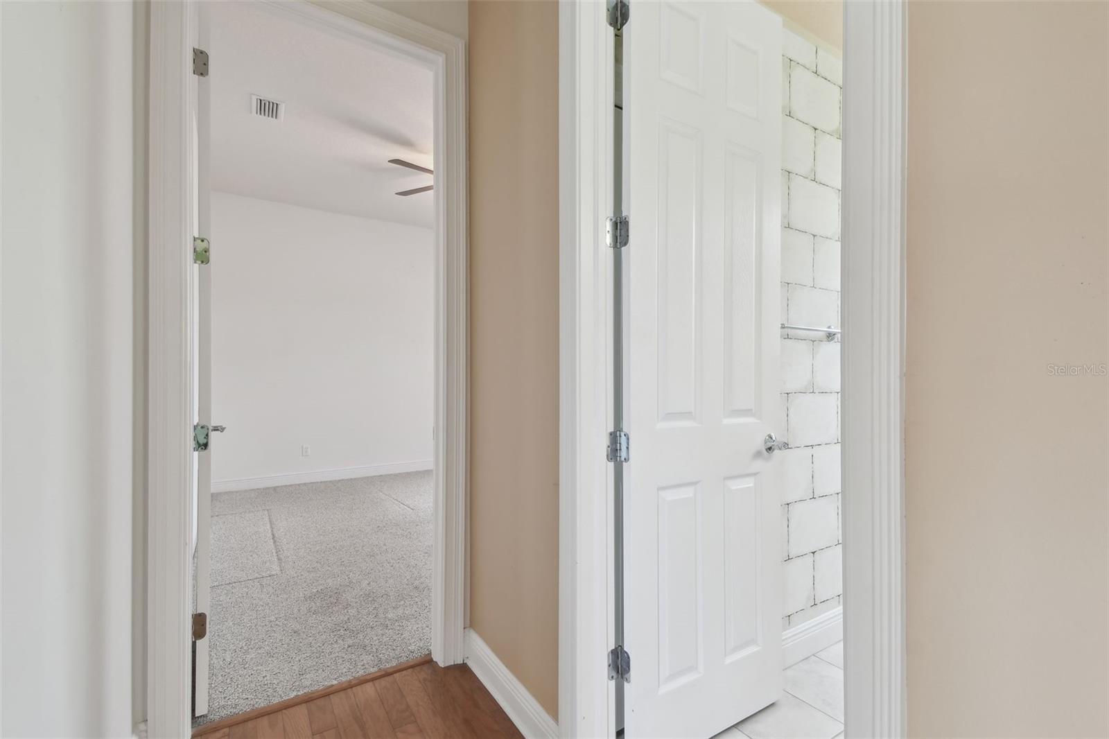 Entrance to Bedroom Three and Doorway to Bathroom Two.