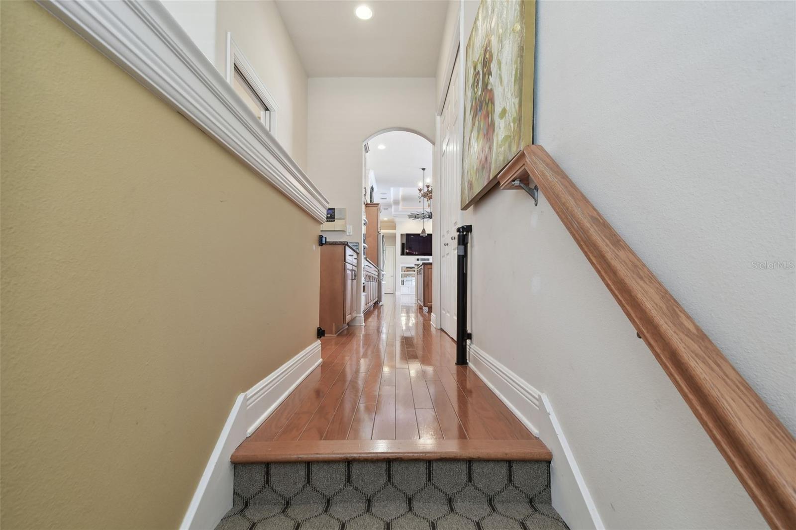 Hallway to laundry room, kitchen and pantry closet.
