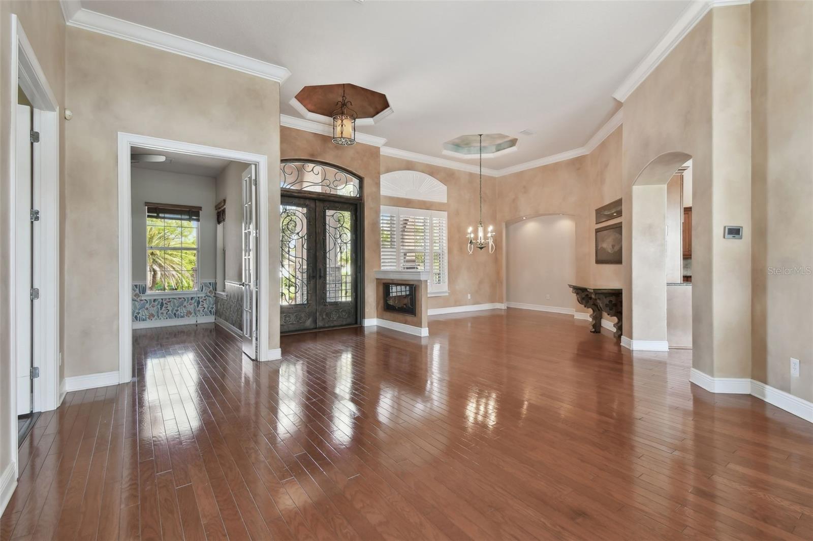 View of the entry to the office, the front door and the dining room.