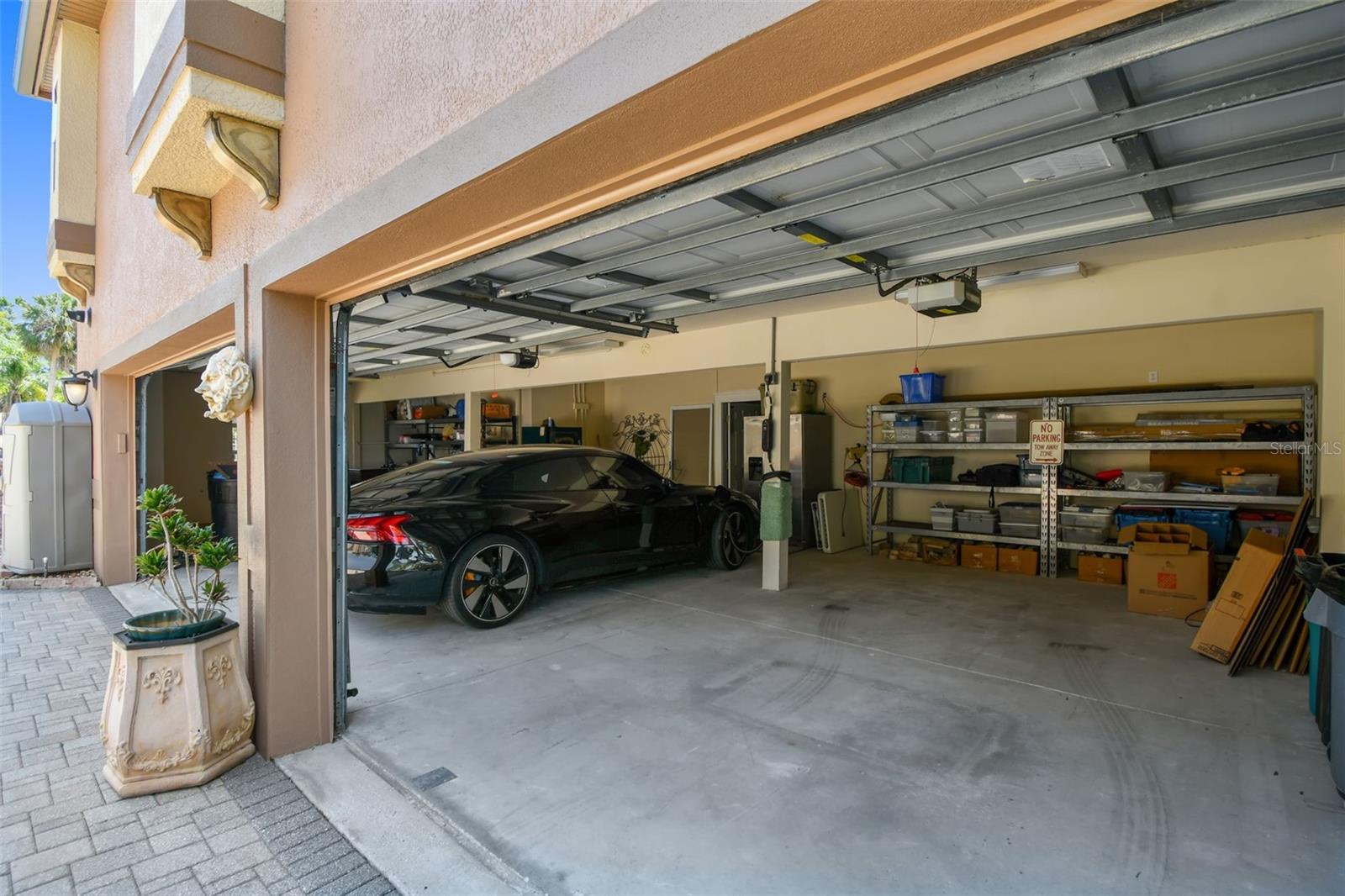 Garage with an electric car charging station.