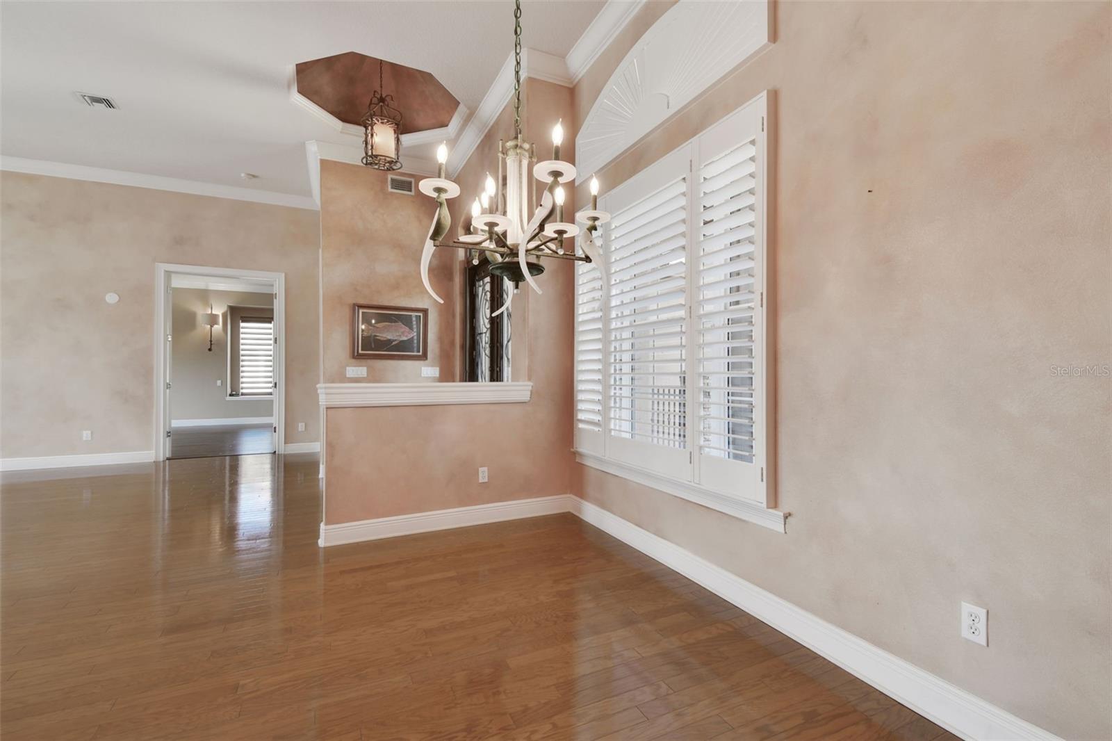 View of dining room towards the entry doors.