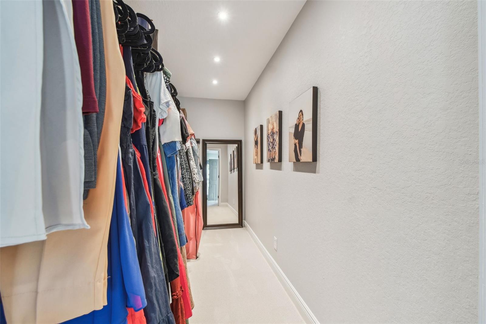 Large walk in Primary Bedroom Closet