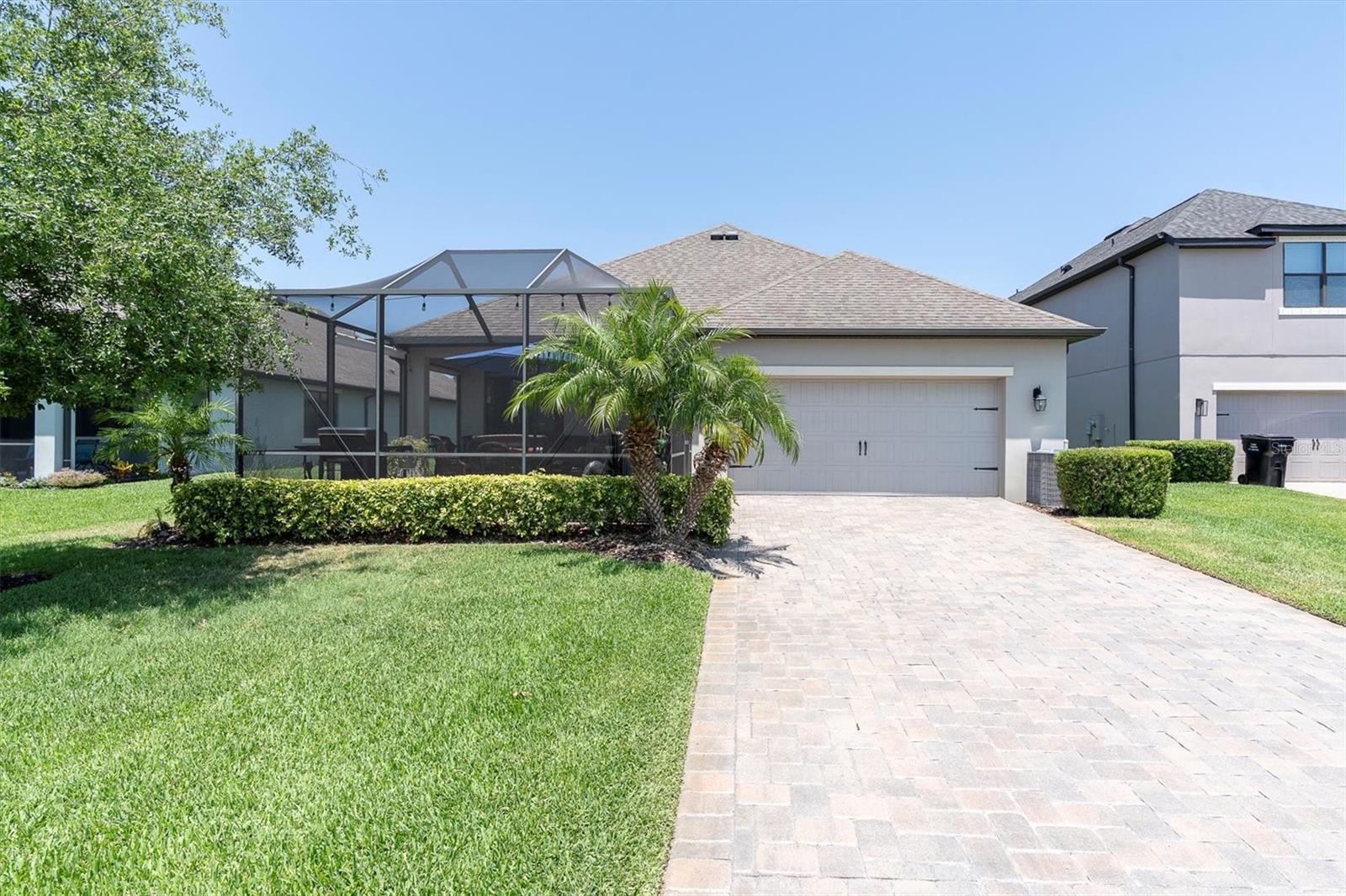 BACKYARD & LONG PAVER DRIVEWAY