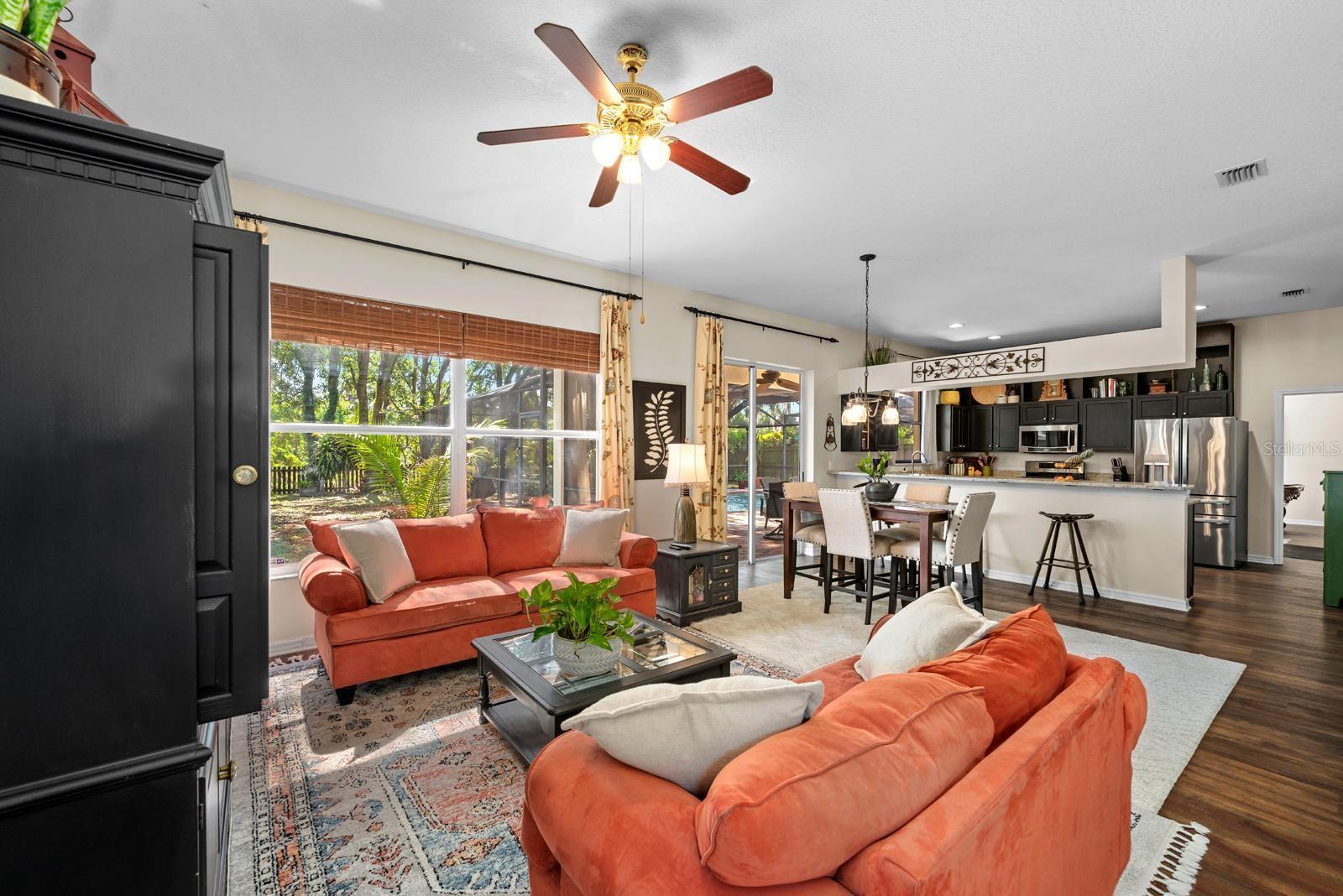 The kitchen is open to the Family room/Living room, a large gathering place.  The door you can see to the right of the kitchen is the huge bonus room.  A separate kids or teens hangout!!!
