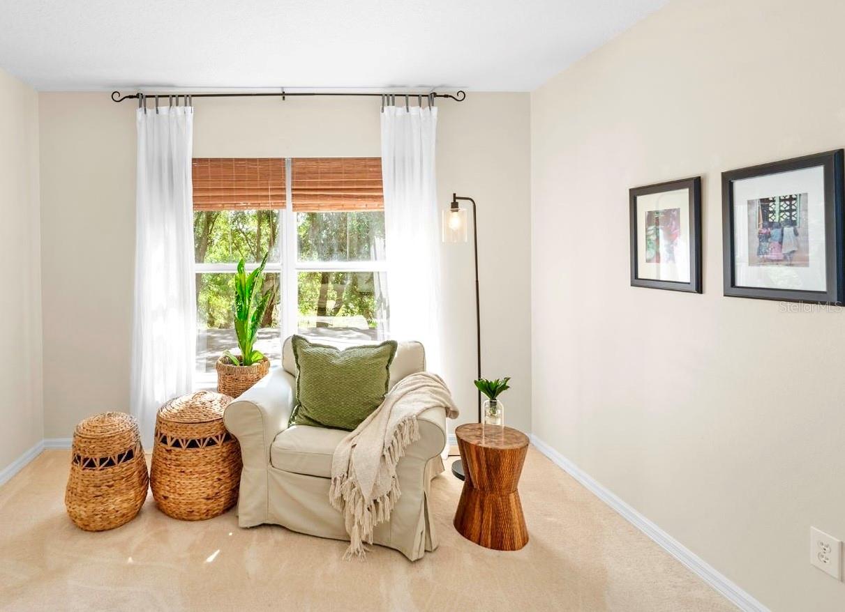 The separate sitting area with natural light flooding in.