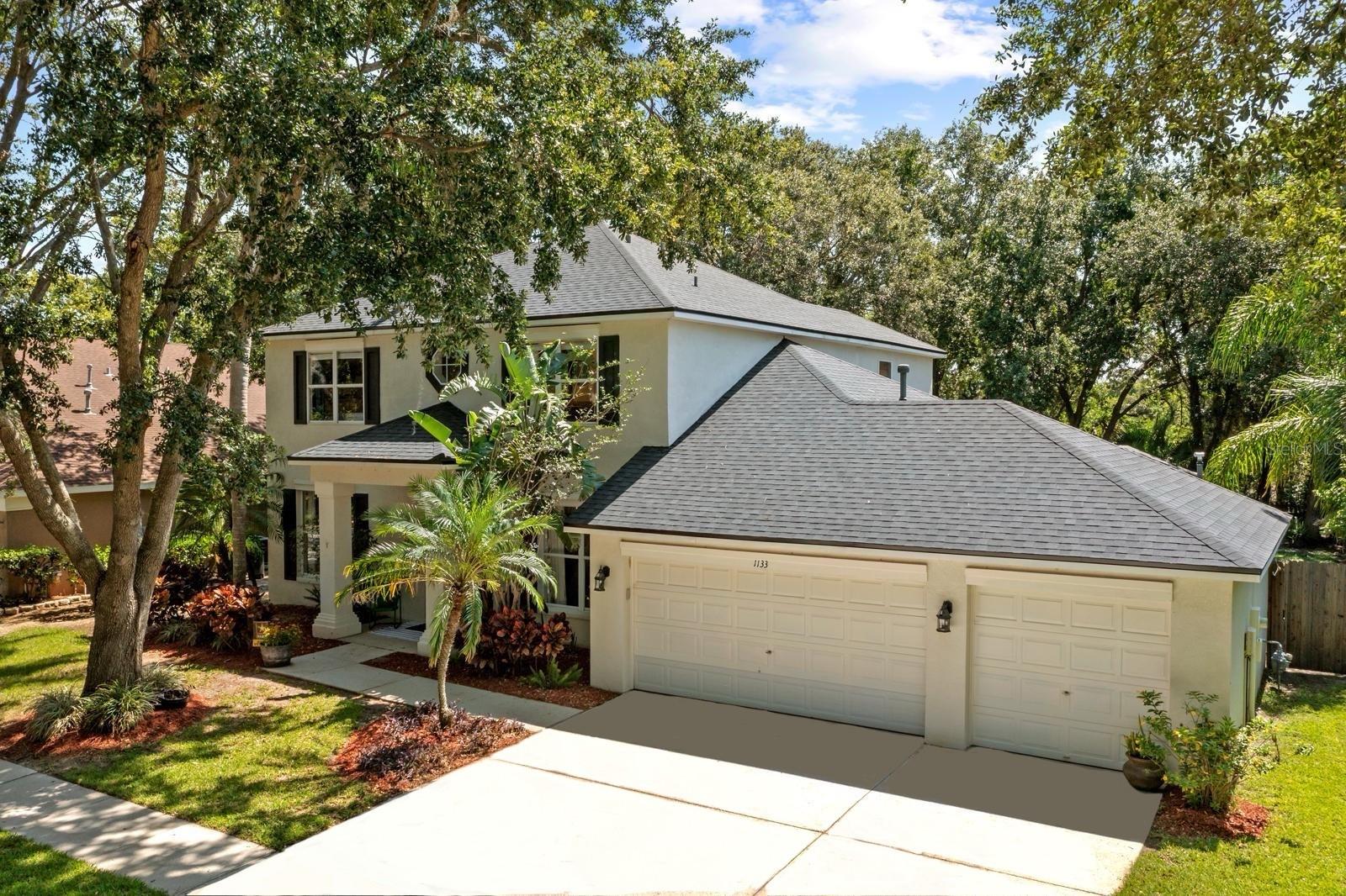 POOL HOME in the heart of BRANDON.....with 3-CAR GARAGE and FULLY FENCED YARD.