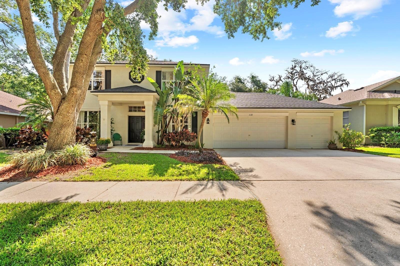 POOL HOME in the heart of BRANDON.....with 3-CAR GARAGE and FULLY FENCED YARD.