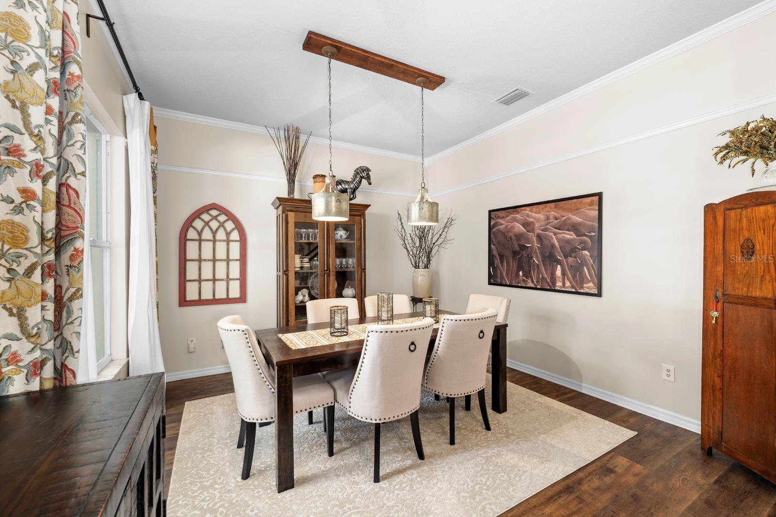 This formal dining space with crown molding can accommodate a very large table, or this space could be used as a second office, a play room, a sitting room, or whatever your needs are.