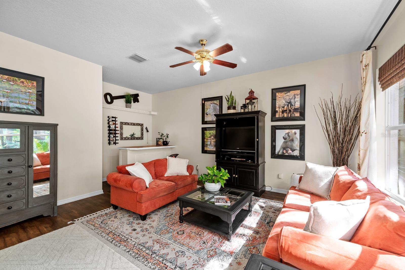 Family room/Living room features vinyl plank floors, a built-in DRY BAR in the corner, and a large, under-the-stairs closet over there too.