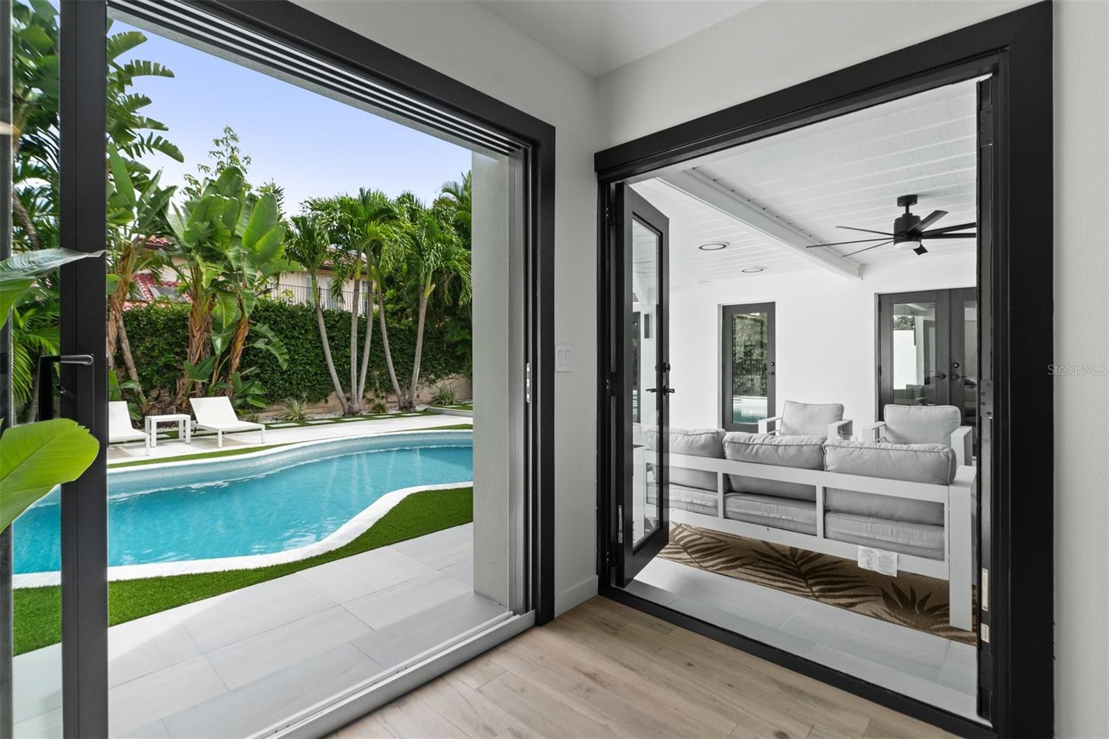 Opens to pool and covered patio