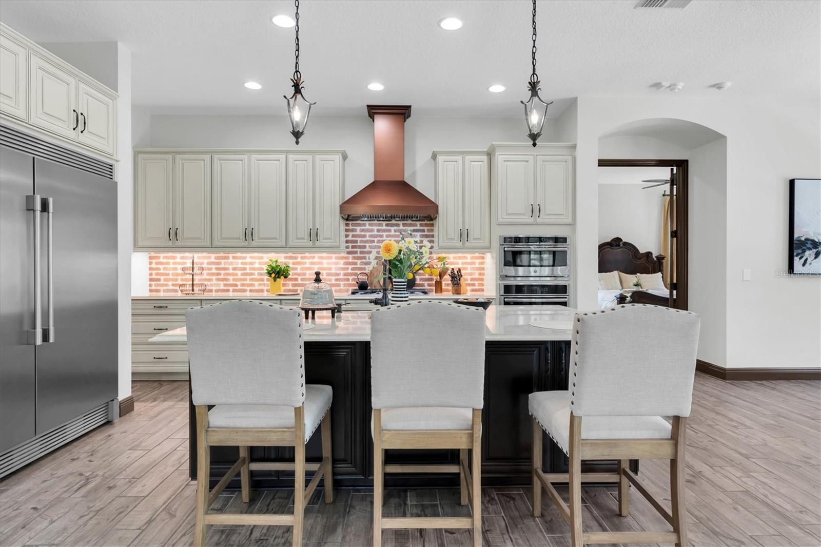 HAVE A SEAT AT THE EXTENDED ISLAND W/ KNEE-WALL CABINETS