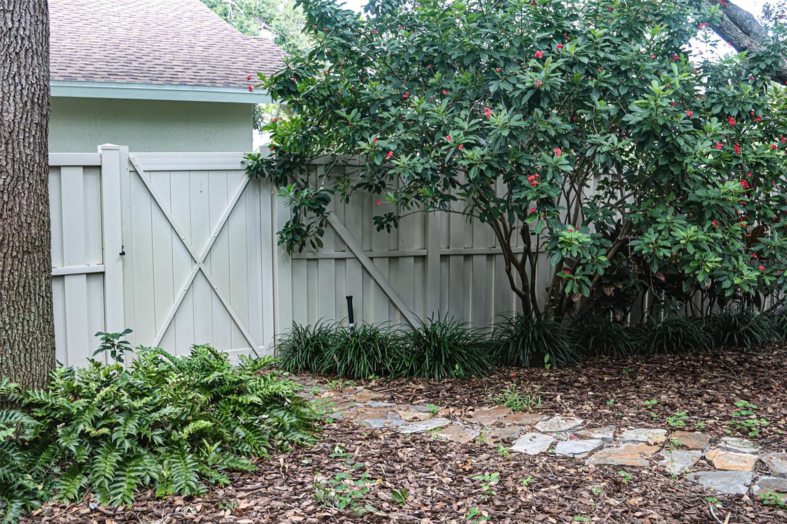 Gate to common grassy area and leads to lake area.