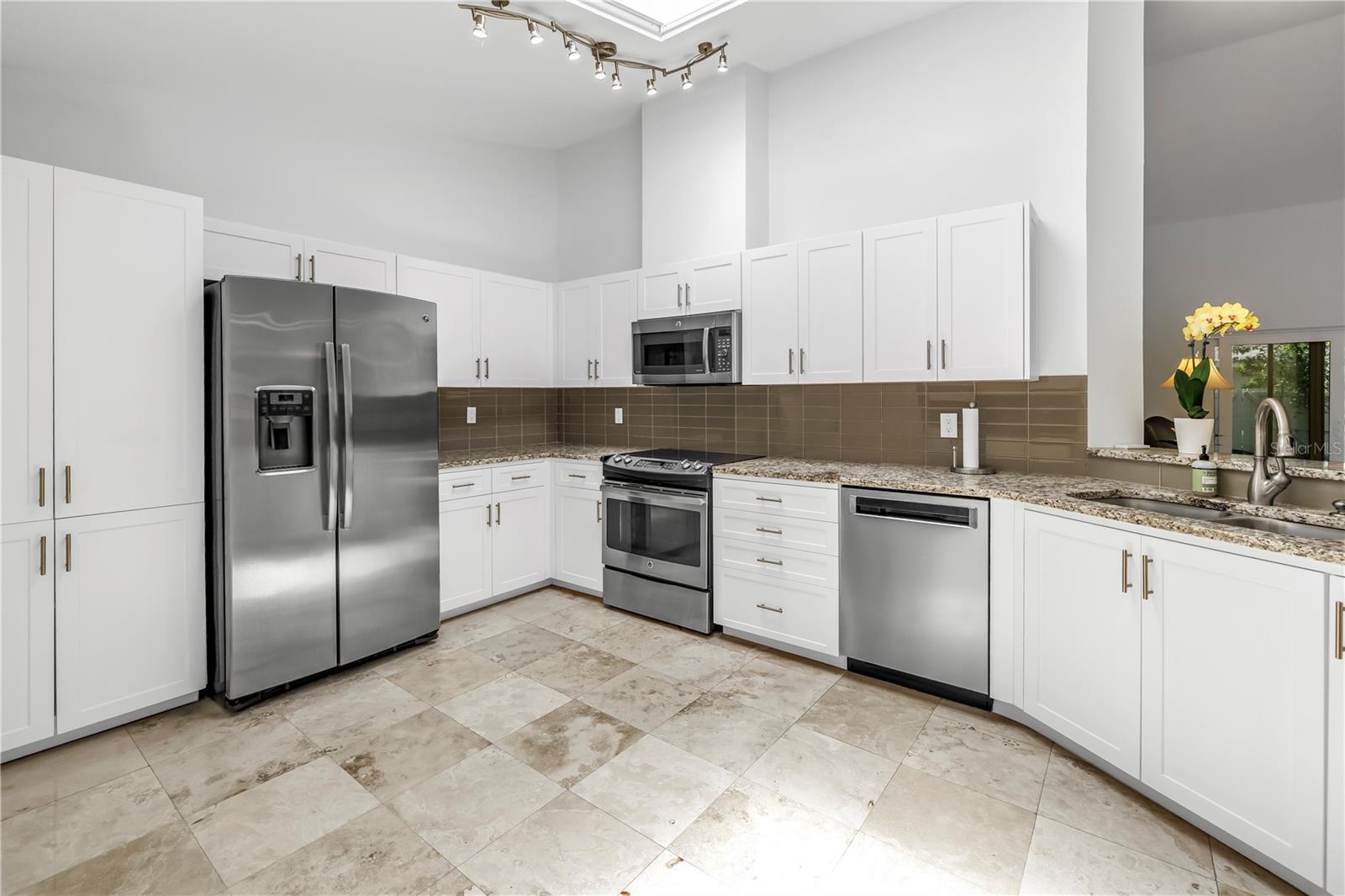Large Kitchen Space with Updated cabinetry and Lots of granite workspace