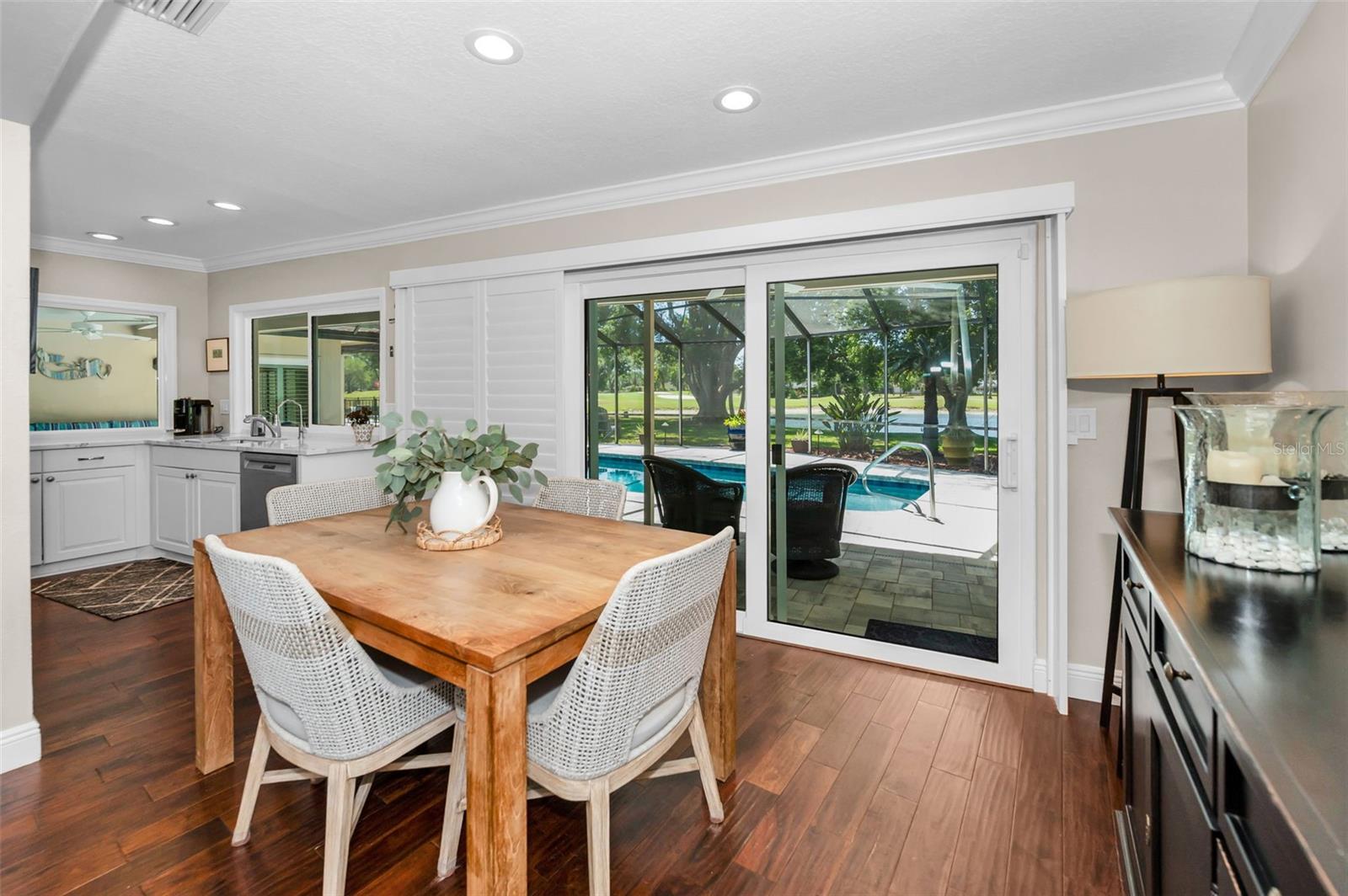 Breakfast dining area overlooking lanai, pool and backyard
