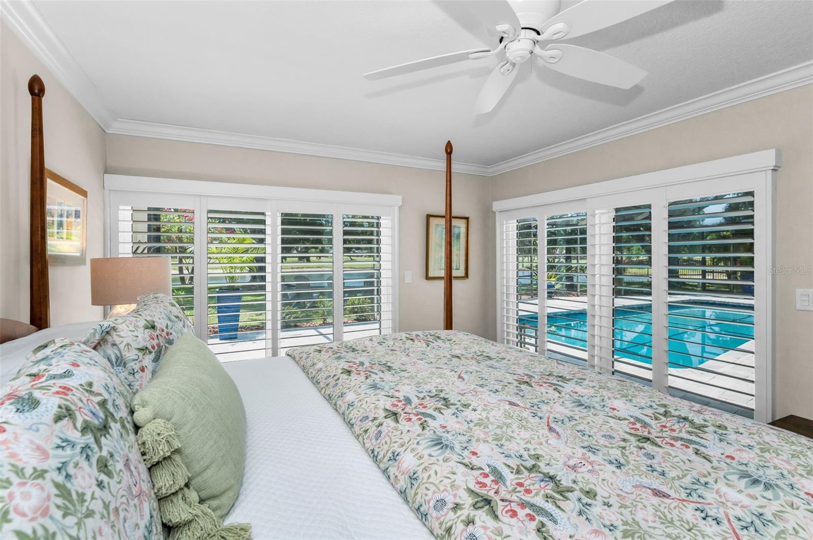 Serene view through custom shutters and sliding doors to the lanai