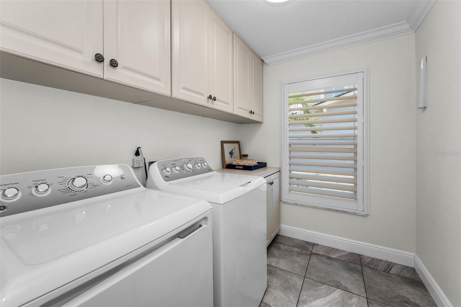 Laundry room with cabinetry and room for hang drying