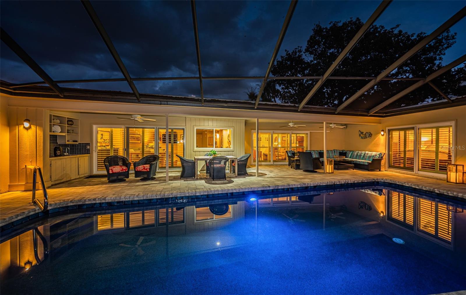 Alternate view of pool and lanai seating areas