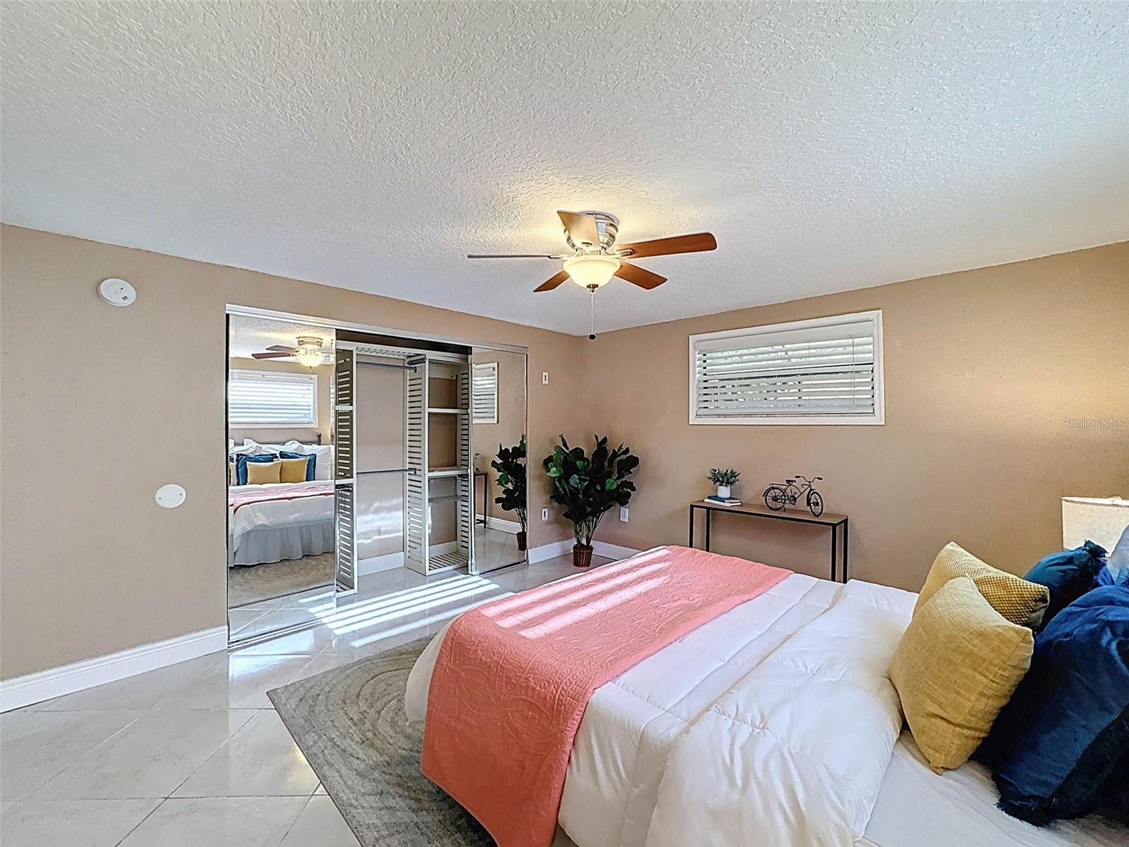 WITH MIRRORED CLOSET DOORS..