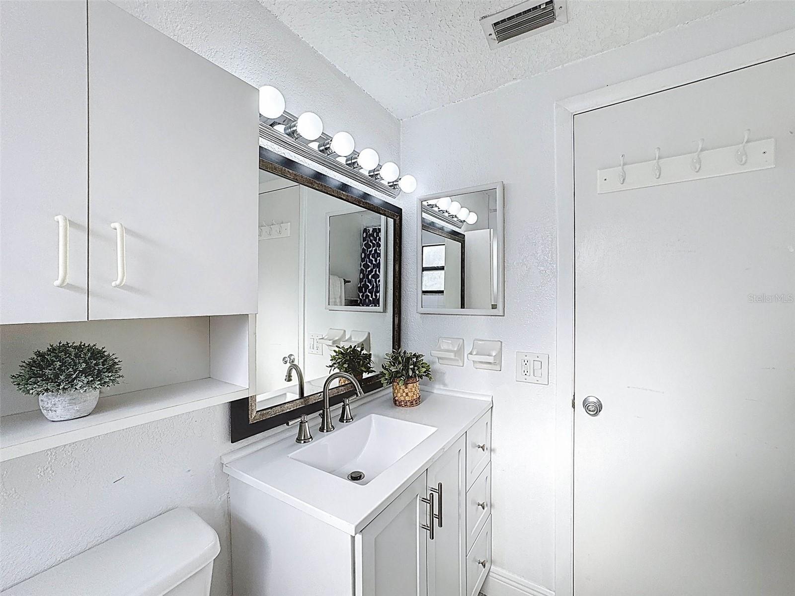 LOTS OF STORAGE IN THIS BATHROOM