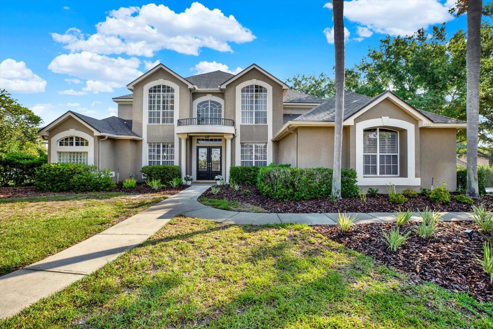 Generous corner lot home on a cul-de-sac street in the gated community of Presidents Landing in Lansbrook.