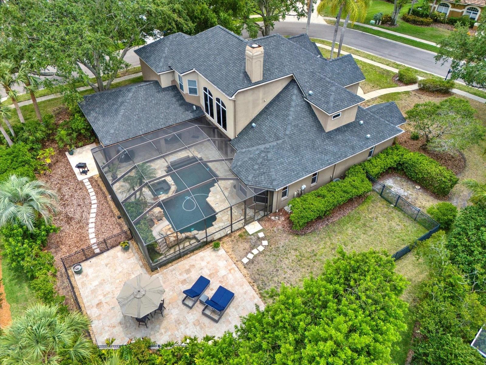 Private fully fenced yard with covered pool / lanai and expansive outdoor deck. Newer Roof (2022)