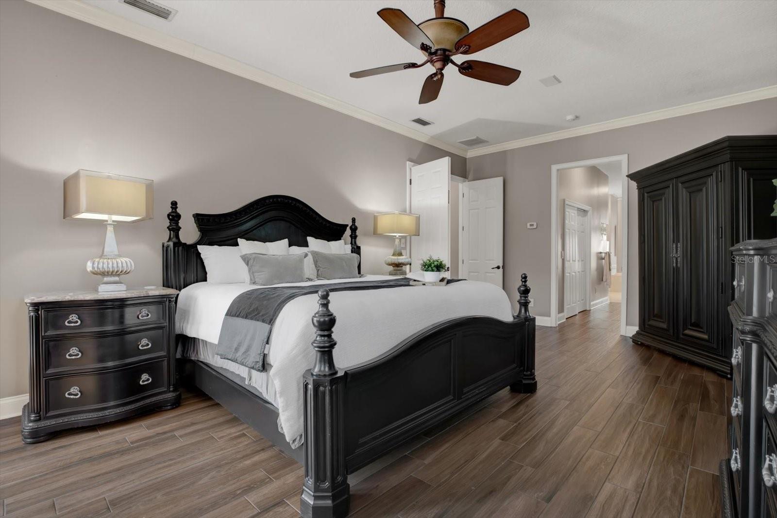 Double door entry into the primary suite  which features 2 large walk in closets.