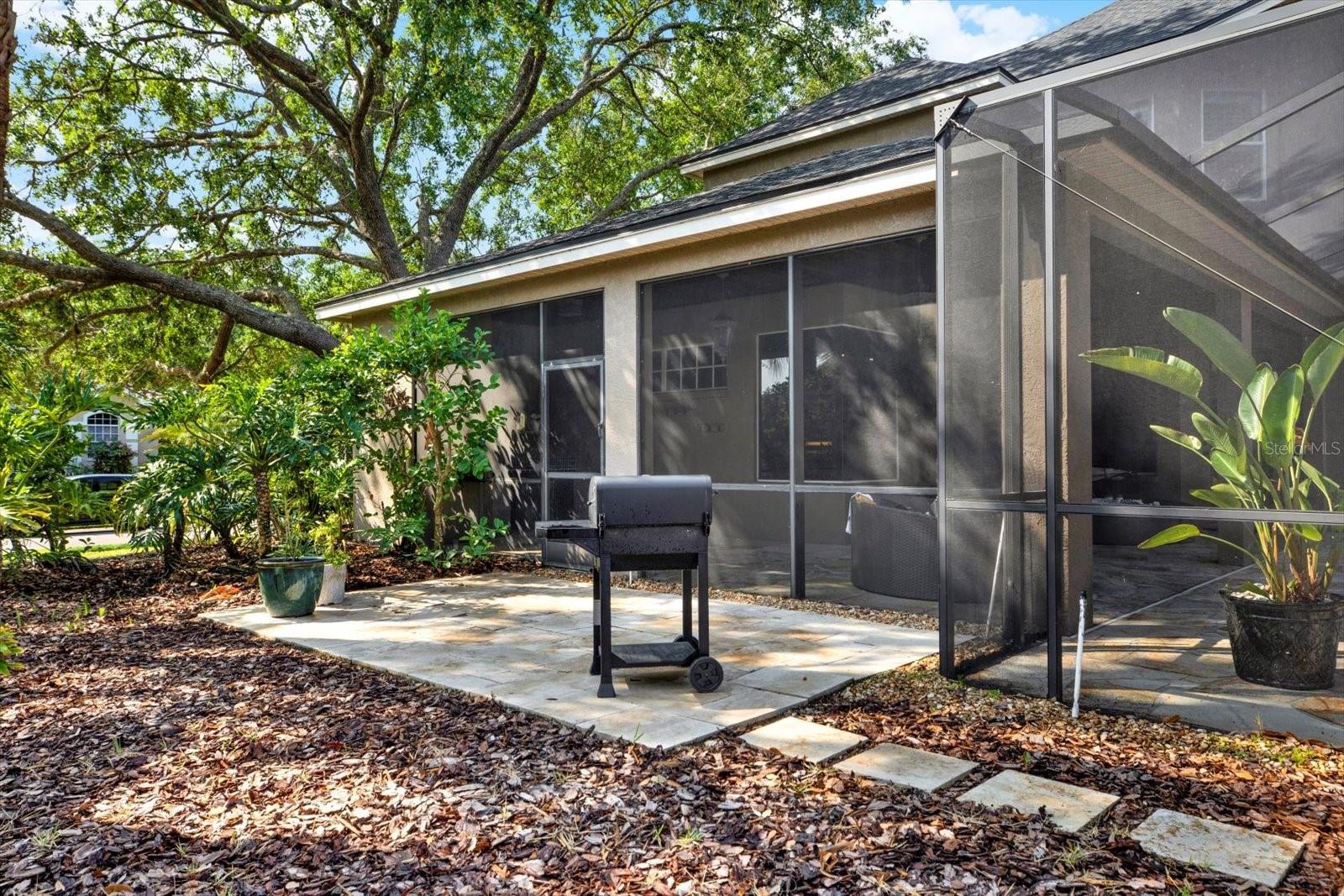 Paved grill area near wet bar.