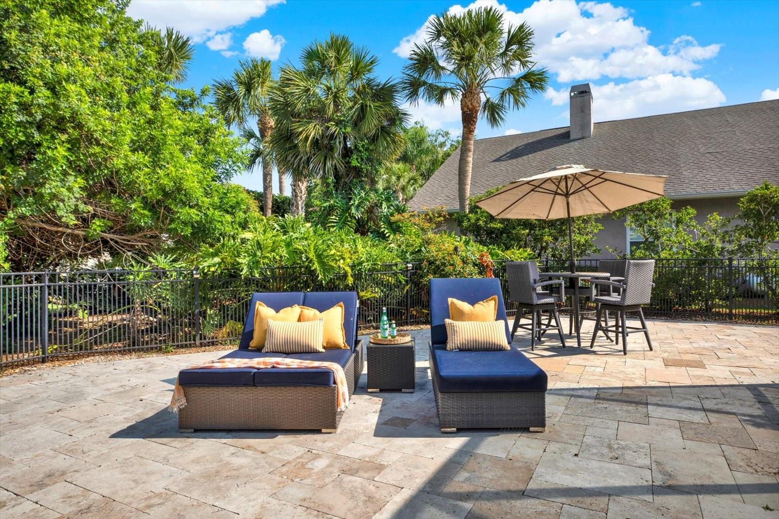 Additional large paved outdoor space for lounging in the sun or BBQ gatherings.