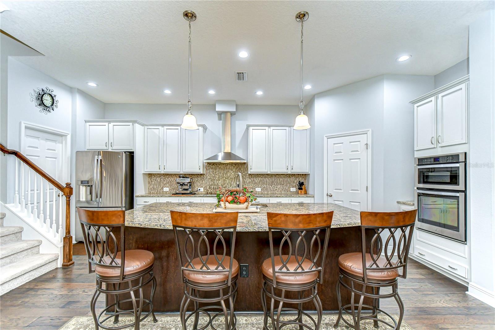 Check out the large center island with bar seating and built-in appliances!