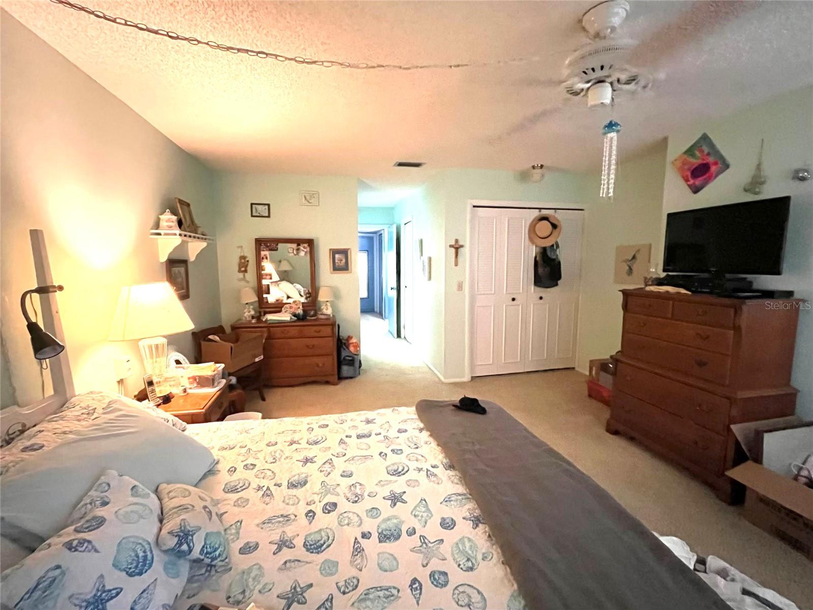 LARGE BEDROOM WITH WALK-IN CLOSET AND ATTACHED BATHROOM.