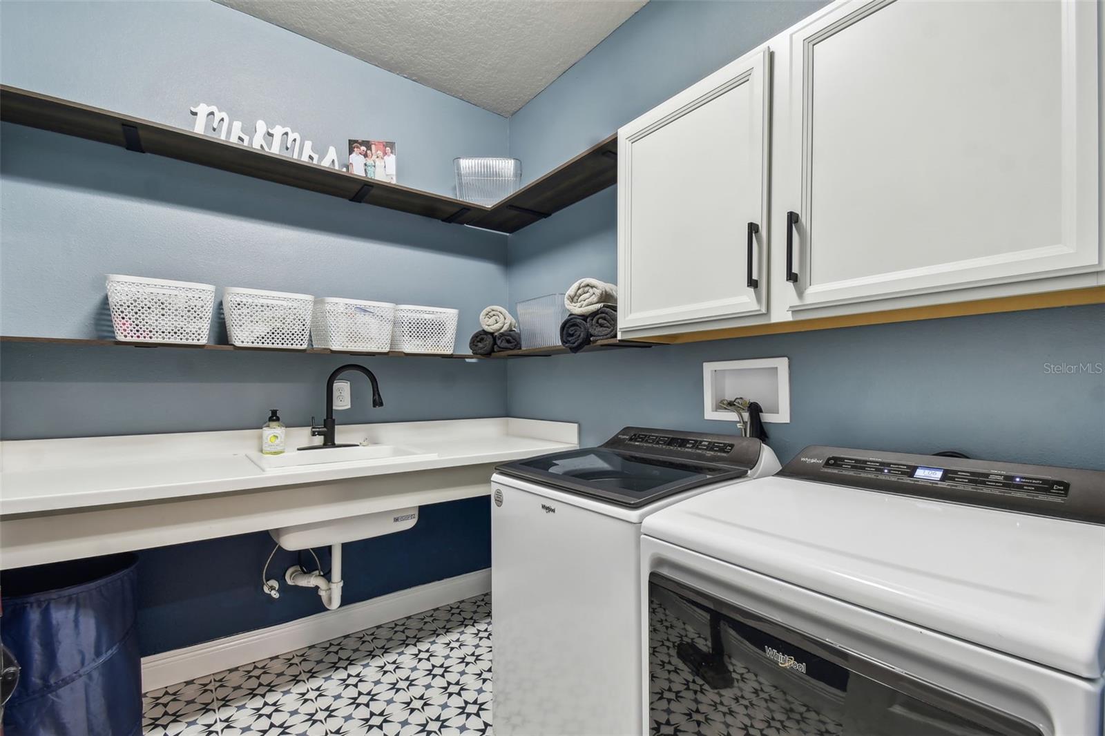 Laundry Room with sink and space for folding clothes.