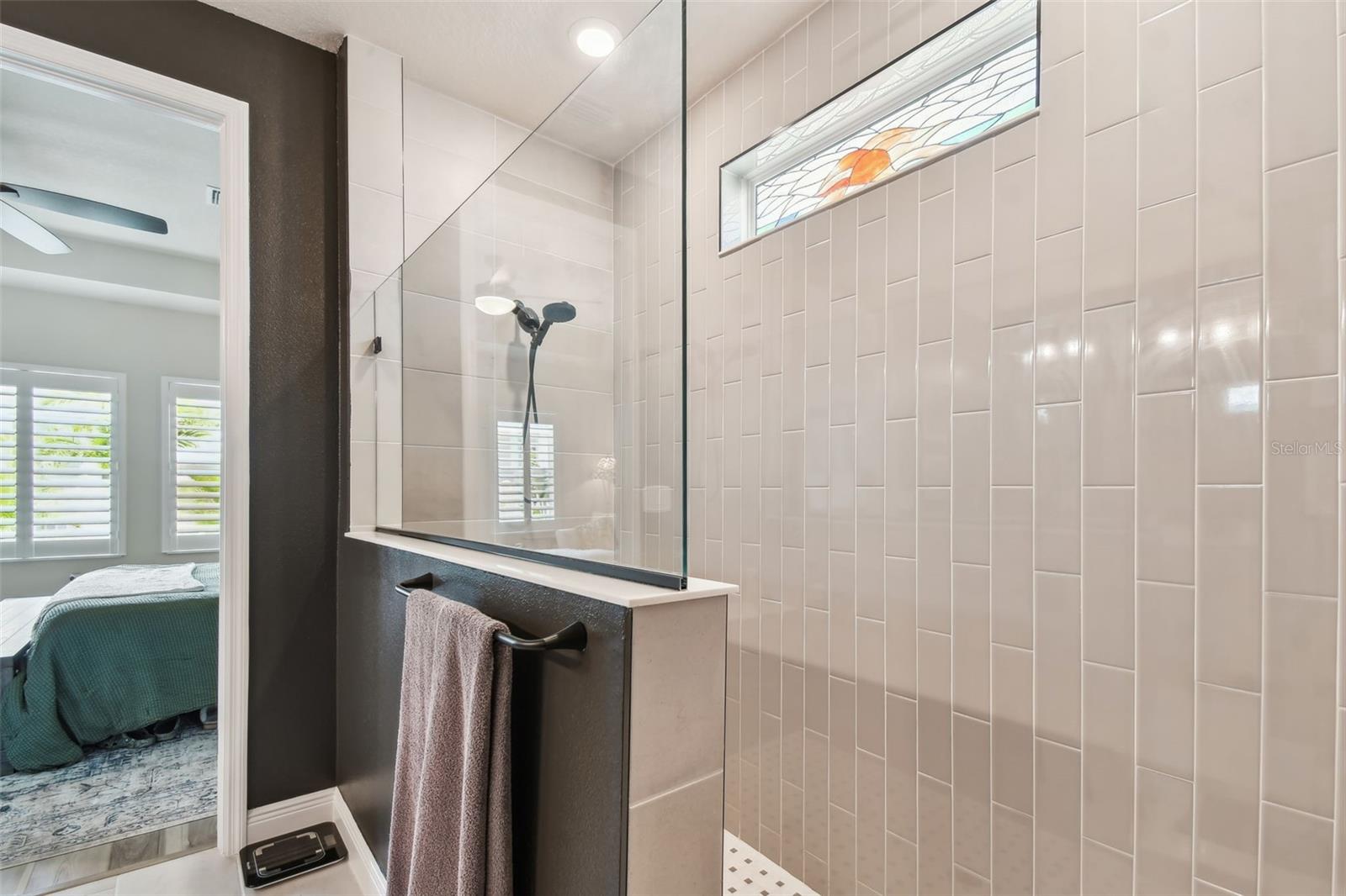Large walk-in shower with secondary rain showerhead