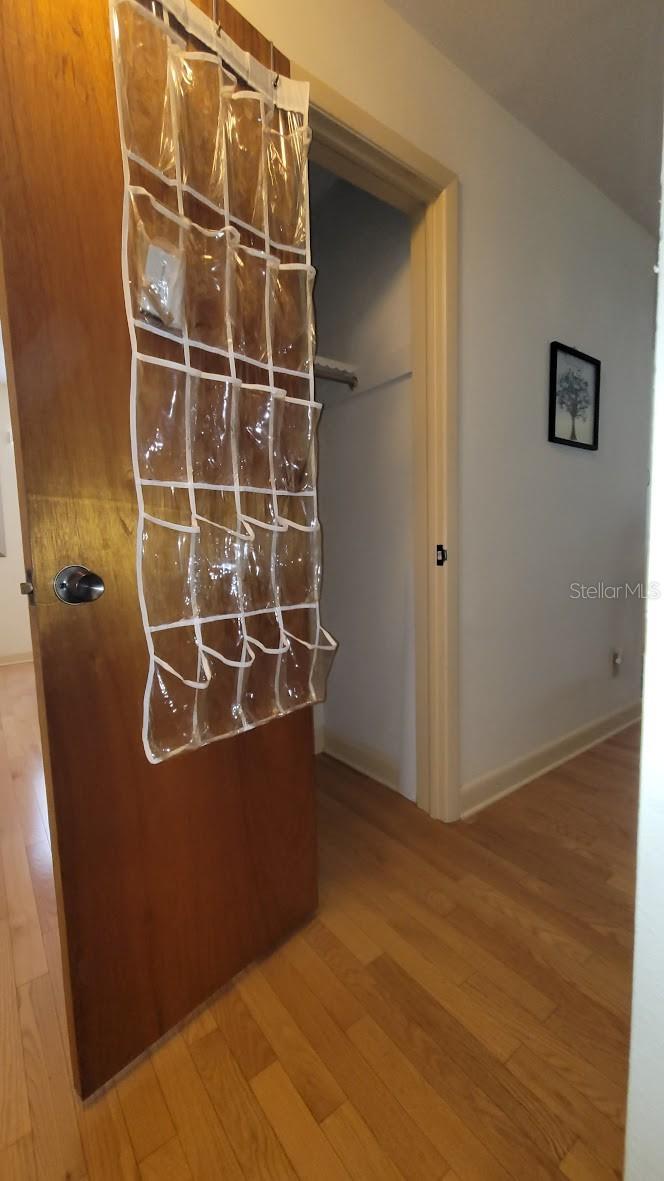 Hall closet with additional storage.