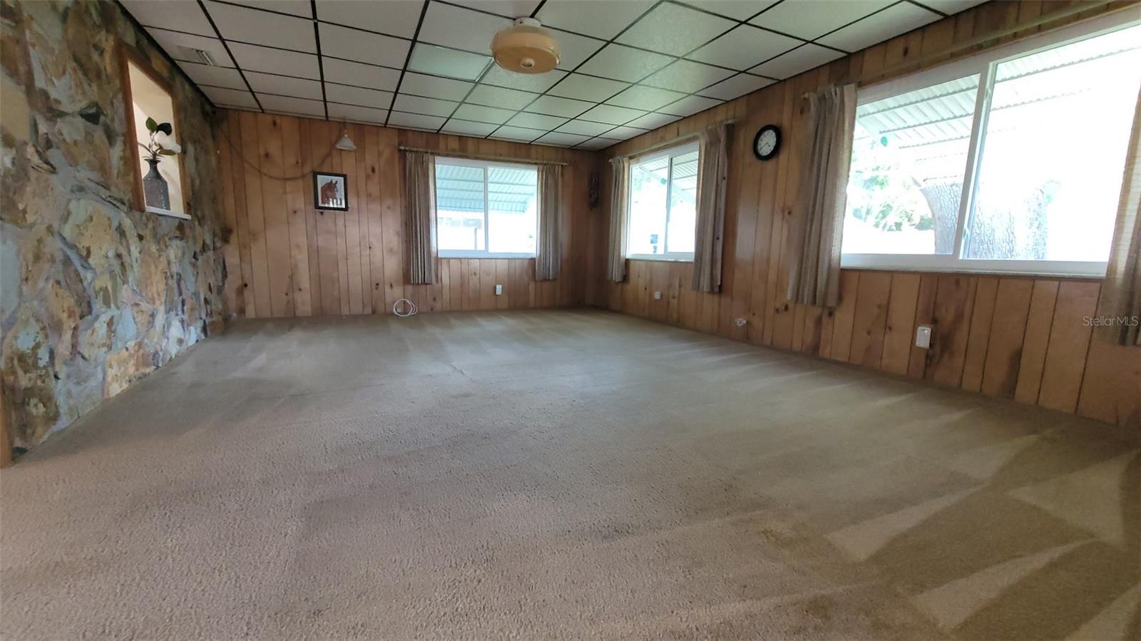 This 20X15 Family Room is ideal for entertaining, game nights, and family time! Notice the pass-through window on the left.