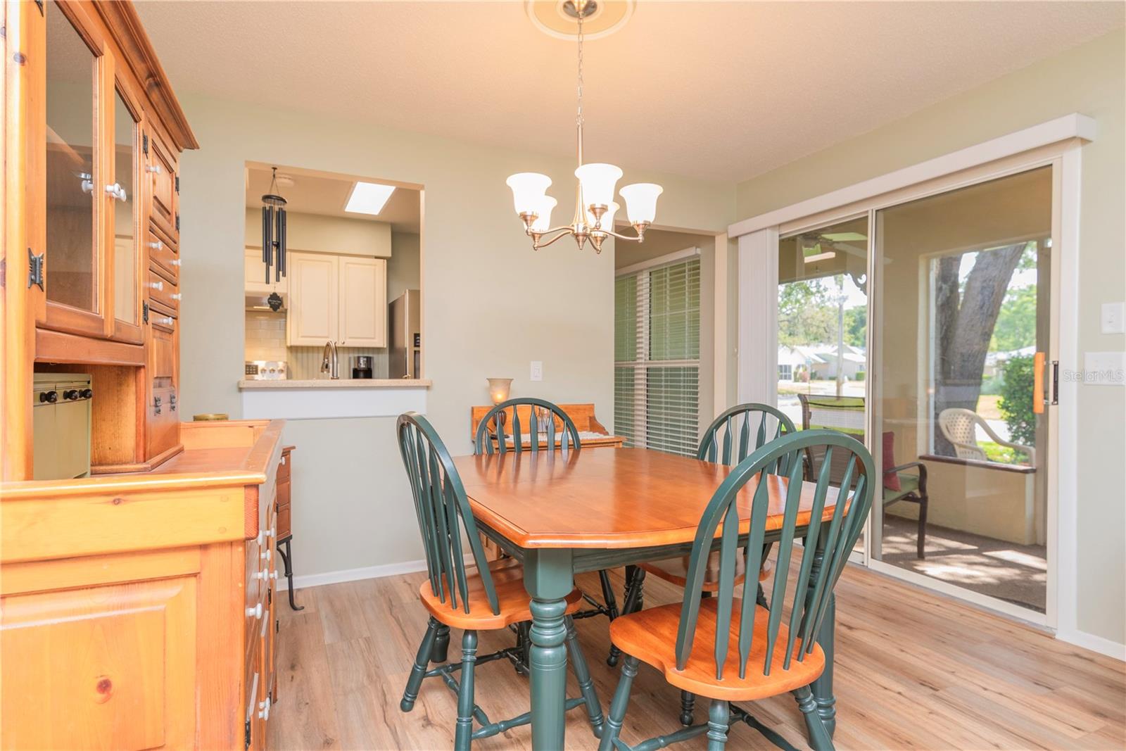 Dining room with sliders to the screen porch.