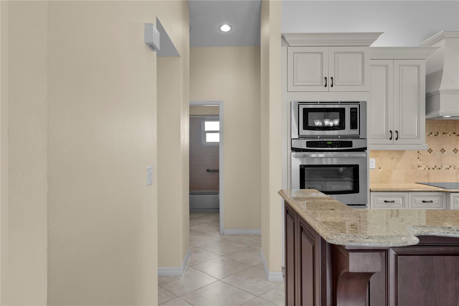 Hall to two additional bedrooms and a hall bath.