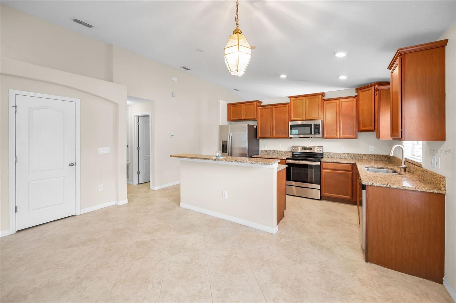 Kitchen adjoins the nice size familyroom